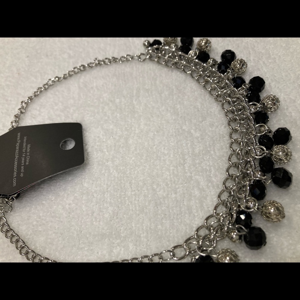 Black and silver necklace with matching earrings